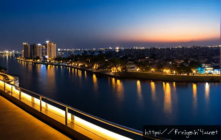 Home 17 라고스 야경이 아름다운 곳 - Photorealistic panoramic night view of Lagos, Nigeria from a waterfront terrace, glittering Victoria...